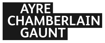 Logo for Ayre Chamberlain Gaunt, displaying the firm's name in bold, white uppercase letters against a black background, inspired by their innovative parking management solutions.