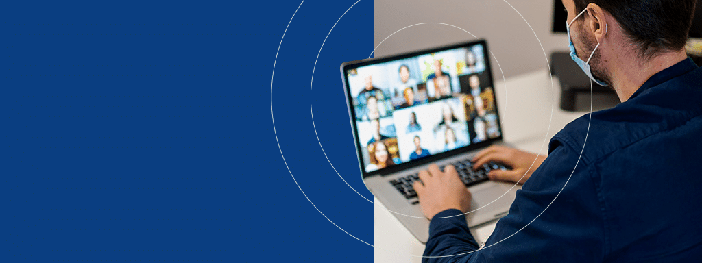 A person wearing a mask participates in a video conference on a laptop, with multiple participants displayed on the screen, discussing efficient parking management solutions from Wayleadr.