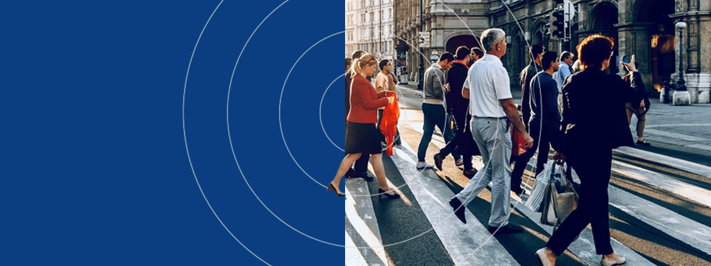 A group of people crossing a street in an urban area. The scene is split, with the left side featuring a blue background and concentric circles, subtly hinting at modern parking lot systems in the vicinity.