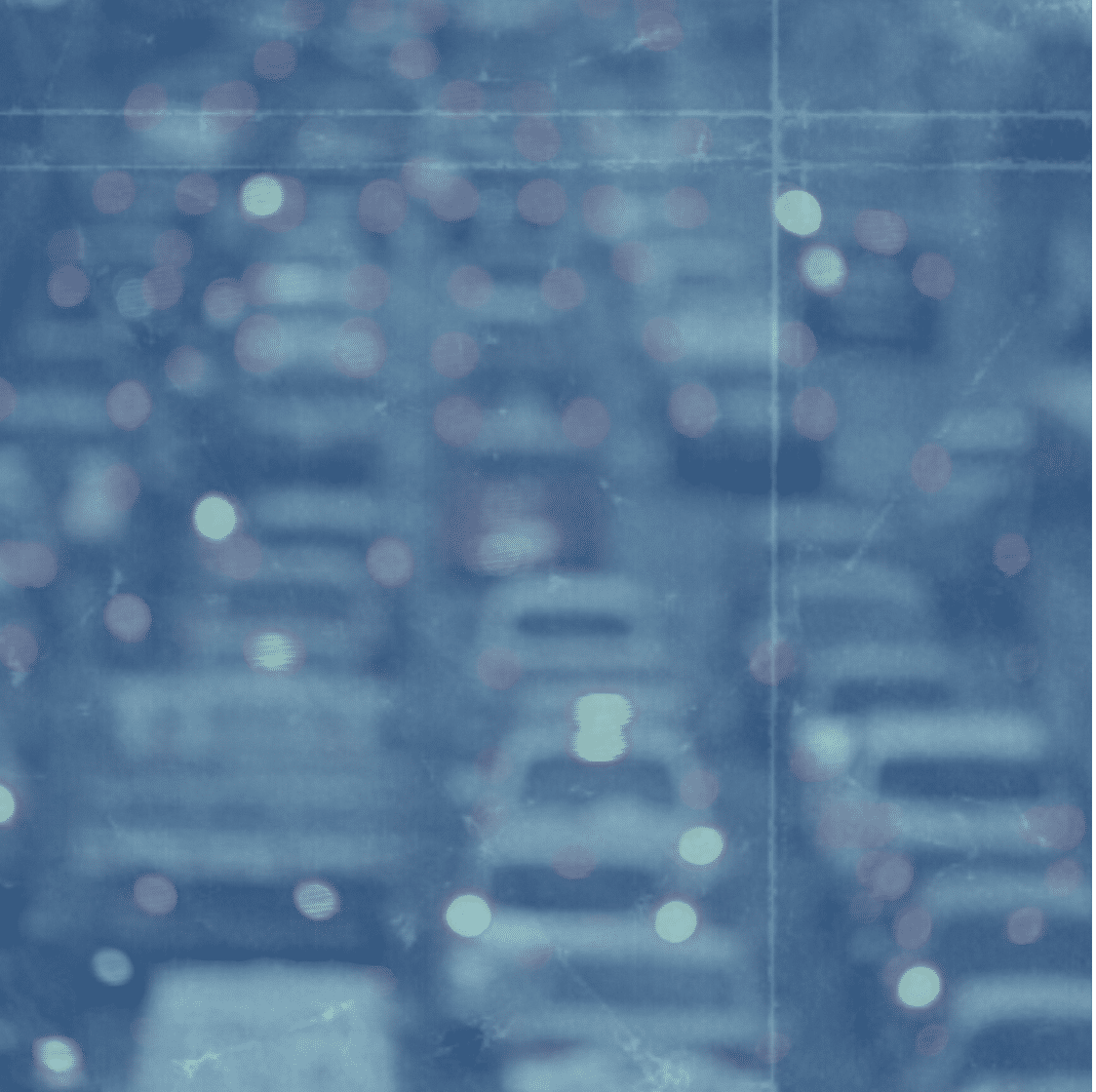 Blurred image of a traffic jam on a road with indistinct vehicles and lights, possibly leading to commercial parking or visitor parking areas. Blue overlay adds a textured effect.